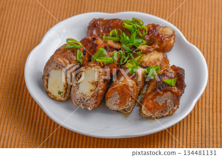 Carrot and deep-fried tofu wrapped in meat Carrot and deep-fried tofu wrapped in meat 134481131