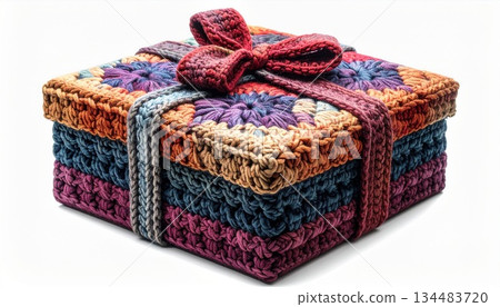 Colorful Knitted Gift Box with Bow on White Background Studio Shot 134483720
