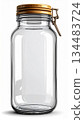 Clear Glass Jar with Golden Lid in Studio Shot on White Background 134483724