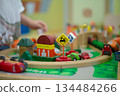 Wooden colorful toy in transportation concept comprised of train and cars. 134484266