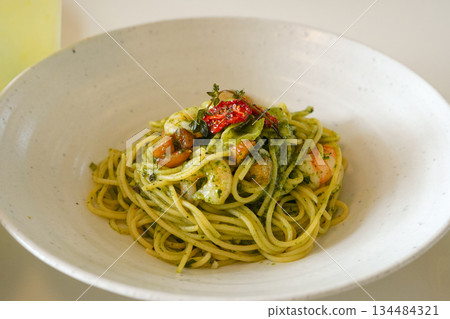 Basil Pesto Pasta with Shrimp and Sun-Dried Tomatoes in a Wide White Bowl Basil Pesto Pasta with Shrimp and Sun-Dried Tomatoes in a Wide White Bowl 134484321