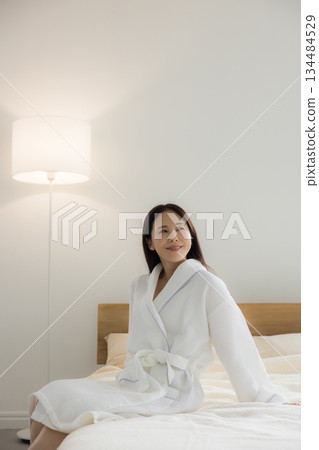 A woman relaxing at bed 134484529