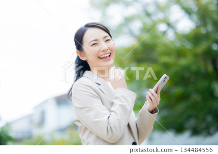 Businesswoman walking in the park 134484556