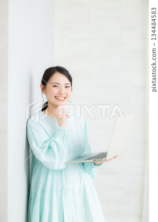 A woman using a computer 134484583