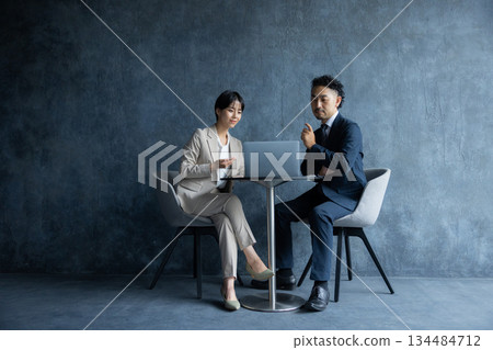A businessman sitting in a chair A businessman sitting in a chair 134484712