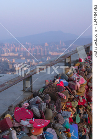 Seoul City Skyline Viewed Over the Railing Piled High with Numerous Love Locks at Namsan Tower Seoul City Skyline Viewed Over the Railing Piled High with Numerous Love Locks at Namsan Tower 134484962
