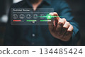 Individual interacting with digital customer review interface, selecting positive feedback option, showcasing modern technology and user engagement 134485424