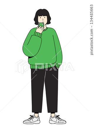 Woman in Green Sweater Taking Selfie 134485663