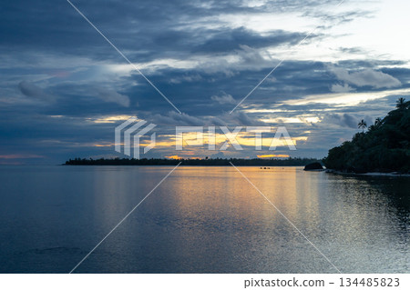 Sunset over the tranquil lagoon of Maupiti, French Polynesia Sunset over the tranquil lagoon of Maupiti, French Polynesia 134485823
