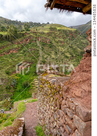 Ancient Inca ruins of Pisac nestled in the Andean mountains, Peru Ancient Inca ruins of Pisac nestled in the Andean mountains, Peru 134485838