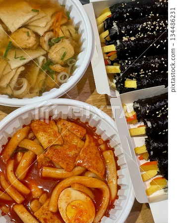 Bunsik, a popular Korean street food, includes various dishes like tteokbokki, odeng, and gimbap. It's a tasty, comforting snack loved by many, perfect for casual gatherings or quick bites. 134486231
