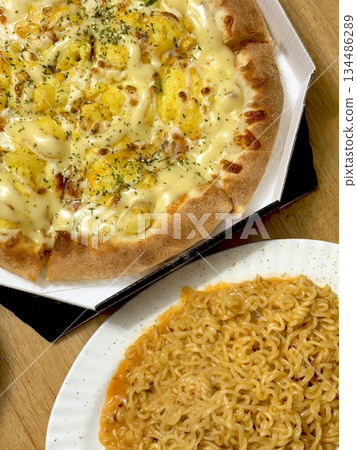 A delicious pizza with a golden crust, melted cheese, and savory toppings. Perfect for food-related designs, menus, or Italian-themed projects, capturing the essence of a classic comfort dish. 134486289