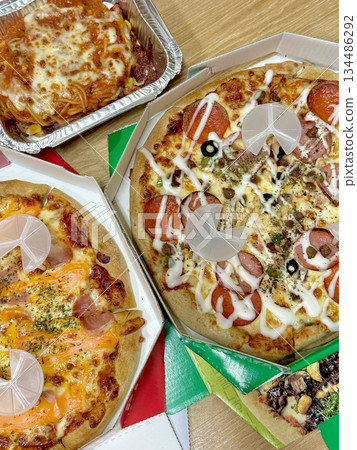 A delicious pizza with a golden crust, melted cheese, and savory toppings. Perfect for food-related designs, menus, or Italian-themed projects, capturing the essence of a classic comfort dish. 134486292