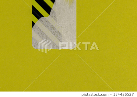 an open yellow package with a torn protective sticker against theft, a torn striped sticker to protect the goods from opening, indicating that the box was opened an open yellow package with a torn protective sticker against theft, a torn striped sticker to protect the goods from opening, indicating that the box was opened 134486527