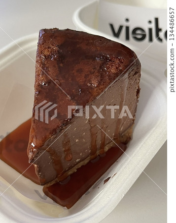 Rich and velvety chocolate cheesecake slice with a smooth, creamy texture and deep cocoa flavor. A perfect balance of indulgence and sweetness for a decadent dessert experience. Rich and velvety chocolate cheesecake slice with a smooth, creamy texture and deep cocoa flavor. A perfect balance of indulgence and sweetness for a decadent dessert experience. 134486657