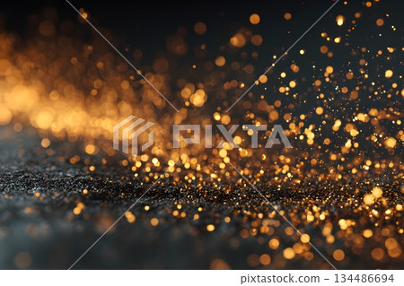 奢華的黑色背景,點綴著閃閃發光的金色顆粒 奢華的黑色背景,點綴著閃閃發光的金色顆粒 134486694