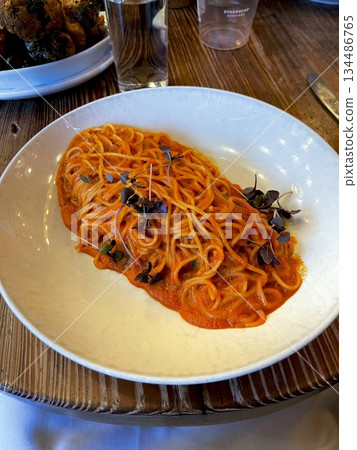 Classic spaghetti coated in rich tomato sauce, offering a simple yet delicious combination of tangy, savory flavors perfect for a comforting meal. Classic spaghetti coated in rich tomato sauce, offering a simple yet delicious combination of tangy, savory flavors perfect for a comforting meal. 134486765