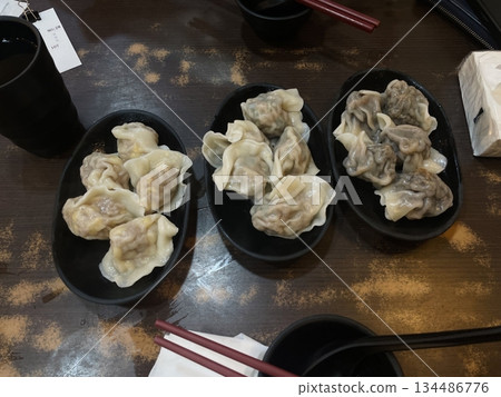 Korean dumplings filled with a mix of savory ingredients like ground meat, tofu, and vegetables. Mandu can be steamed, boiled, or pan-fried, making it a versatile and delicious snack or meal. Korean dumplings filled with a mix of savory ingredients like ground meat, tofu, and vegetables. Mandu can be steamed, boiled, or pan-fried, making it a versatile and delicious snack or meal. 134486776