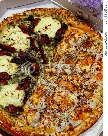 A delicious pizza with a golden crust, melted cheese, and savory toppings. Perfect for food-related designs, menus, or Italian-themed projects, capturing the essence of a classic comfort dish. A delicious pizza with a golden crust, melted cheese, and savory toppings. Perfect for food-related designs, menus, or Italian-themed projects, capturing the essence of a classic comfort dish. 134486815