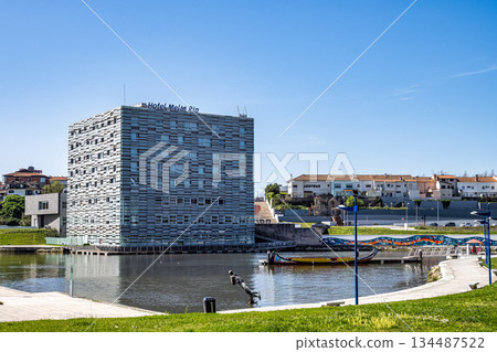 Aveiro, Portugal - Mar 18, 2025: Traditional colorful Moliceiro boats on the canal in Aveiro, Portugal. 134487522