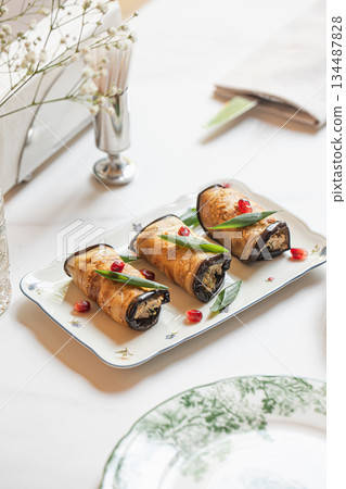 Georgian eggplant rolls with walnut filling 134487828