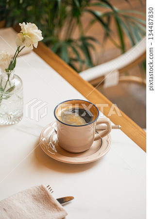 Hot black coffee in ceramic cup Hot black coffee in ceramic cup 134487830