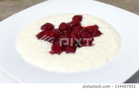 rice pudding with stewed cherries rice pudding with stewed cherries 134487852