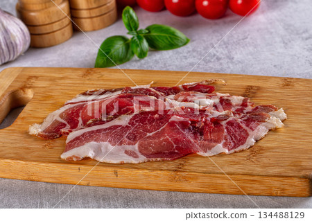 Cured pork Spanish jamon slices 134488129
