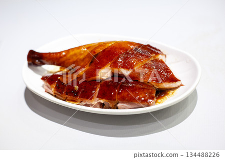 Hong Kong Cantonese style roast goose drumstick on white background Hong Kong Cantonese style roast goose drumstick on white background 134488226