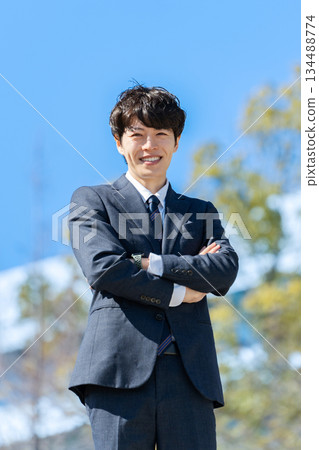Businessman blue sky 134488774