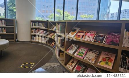 A polished library interior with marble floors and sunlit windows showcases curated cookbooks and lifestyle titles, inviting readers into a calm, organized space for learning and discovery A polished library interior with marble floors and sunlit windows showcases curated cookbooks and lifestyle titles, inviting readers into a calm, organized space for learning and discovery 134488831