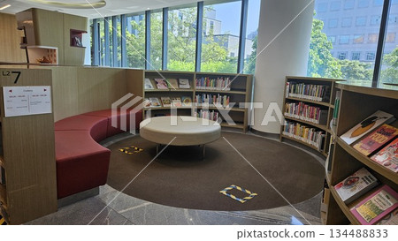 A polished library interior with marble floors and sunlit windows showcases curated cookbooks and lifestyle titles, inviting readers into a calm, organized space for learning and discovery A polished library interior with marble floors and sunlit windows showcases curated cookbooks and lifestyle titles, inviting readers into a calm, organized space for learning and discovery 134488833