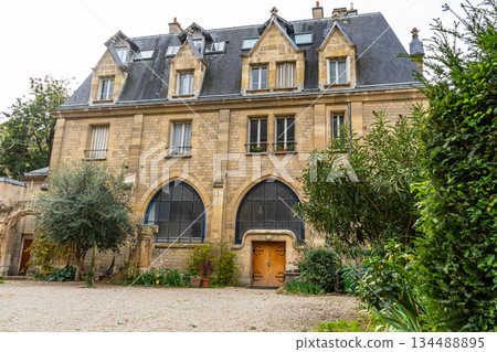 House wall facade. Mini garden in Paris France in back yard. Old building French architecture House wall facade. Mini garden in Paris France in back yard. Old building French architecture 134488895