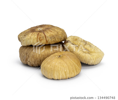 Pile of dried figs on a white background Pile of dried figs on a white background 134490748
