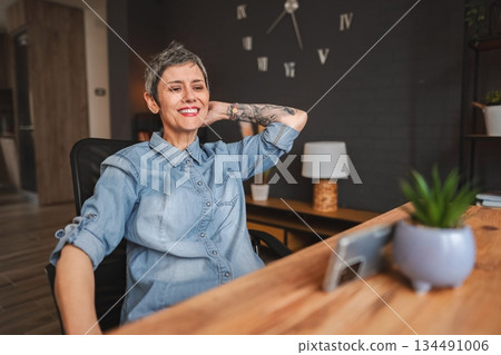 Relaxed Freelancer Enjoying a Break in Home Office Relaxed Freelancer Enjoying a Break in Home Office 134491006