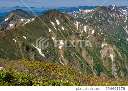 The snow-covered Joetsu border ridge and Mount Asama seen from between Mount Tanigawa and Mount Ichinokura The snow-covered Joetsu border ridge and Mount Asama seen from between Mount Tanigawa and Mount Ichinokura 134491176