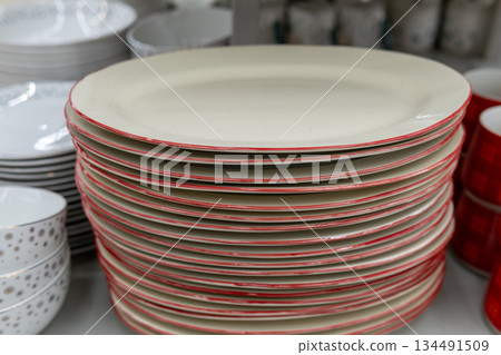 Stacked White Dinner Plates With Red Rim for Kitchen or Dining Tableware Stacked White Dinner Plates With Red Rim for Kitchen or Dining Tableware 134491509