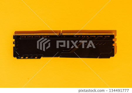 Single black RAM memory module on yellow background Single black RAM memory module on yellow background 134491777