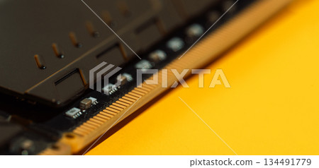 Black RAM module corners on yellow background with copy space Black RAM module corners on yellow background with copy space 134491779