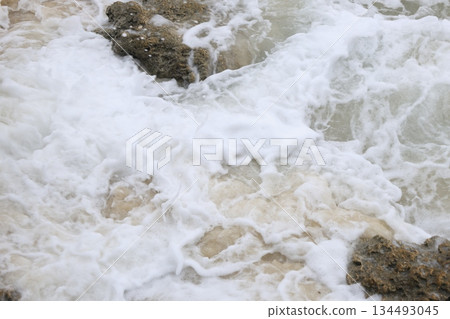 View of high waves in the ocean on a stormy day View of high waves in the ocean on a stormy day 134493045