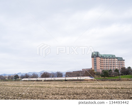 [Yamagata Line] Limited Express Tsubasa train running through the winter countryside 134493442