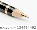 Luxury black and gold pencil closeup with sharp tip 134494492