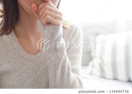 Coughing woman with a cold 134494736