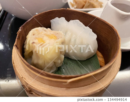 Chive dumplings and Hong Kong-style shumai: A platter of Chinese dim sum Chive dumplings and Hong Kong-style shumai: A platter of Chinese dim sum 134494914