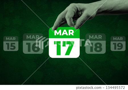 St Patrick day March 17th Calendar Page. Halftone collage of a hand holding a calendar page with the words March 17 St Patrick day March 17th Calendar Page. Halftone collage of a hand holding a calendar page with the words March 17 134495572