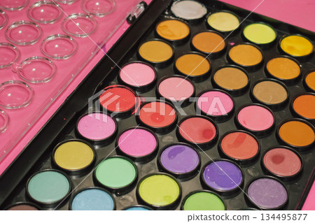 Rectangular watercolor paint set: vibrant pink, blue, and orange art palette close-up 134495877