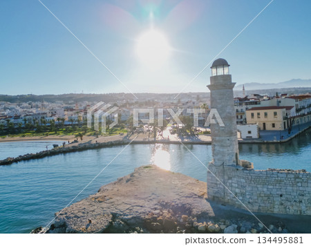 Egyptian lighthouse in the Venetian harbour of Rethymno and the waterfront of Crete most beautiful town. Egyptian lighthouse in the Venetian harbour of Rethymno and the waterfront of Crete most beautiful town. 134495881