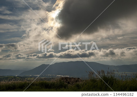 Rays of light peeking through the clouds - Aso outer rim Rays of light peeking through the clouds - Aso outer rim 134496182