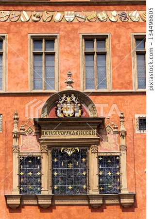 Renaissance tripartite window on Prague Old Town Hall featuring the Latin inscription Praga caput regni and the Old Town coat of arms on a historic stone facade, Prague, Czech republic Renaissance tripartite window on Prague Old Town Hall featuring the Latin inscription Praga caput regni and the Old Town coat of arms on a historic stone facade, Prague, Czech republic 134496605