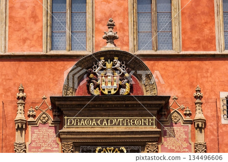 Renaissance tripartite window on Prague Old Town Hall featuring the Latin inscription Praga caput regni and the Old Town coat of arms on a historic stone facade, Prague, Czech republic 134496606